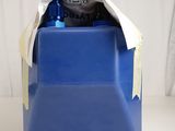 a blue plastic container with a blue lid and a white ribbon around it