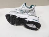 pair of new balance running shoes on a white table