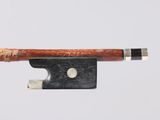 an image of a violin bow with a piece of wood sticking out of it