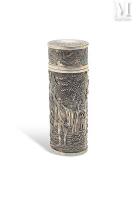 a silver vase with a design on it on a white surface