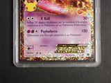 a close up of a pokemon card in a plastic container