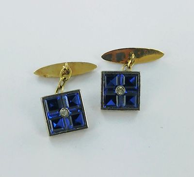 two pairs of blue and gold cufflinks with diamonds on them