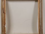 an old picture frame with a white background and a brown frame