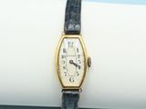 an image of a wrist watch sitting on top of a white napkin
