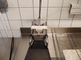 an overhead view of a commercial kitchen with a stove and sink