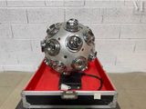a metal ball sitting in a case on a table