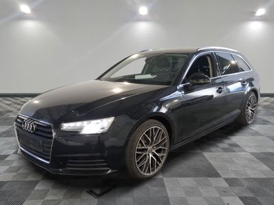 an image of a black audi wagon parked in a garage