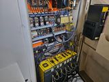 a large electrical panel in the corner of a room
