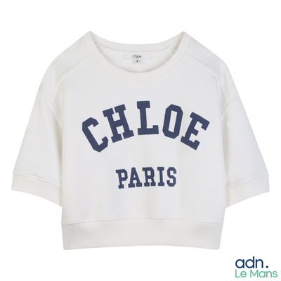 sweat-shirt court blanc avec un logo et un nom bleu marine sur le devant