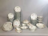 a lot of plates and bowls on a table