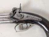 a gun that is sitting on top of a table