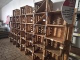 many wooden crates stacked on top of each other in a room