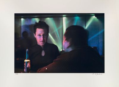 a picture of a man and a woman sitting at a table