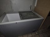 a bathtub in the corner of a bathroom with a door open