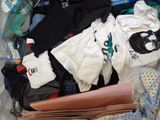 a plastic bag full of clothes and other items