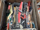 a box full of tools that are sitting on the floor