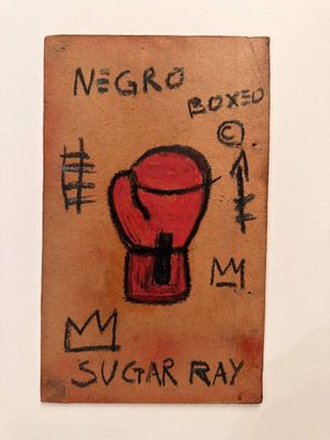 a drawing of a red boxing glove on a piece of paper