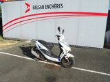 a scooter that is parked in a parking lot