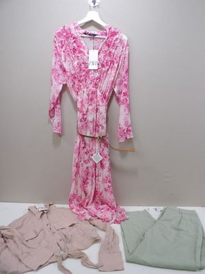 a pink and white robe and a pink and green shirt