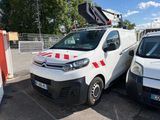 two vans parked in a parking lot next to each other