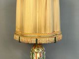 a lamp that is sitting on a wooden stand