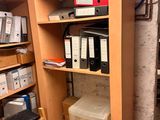 a room with a lot of boxes and boxes on the shelves