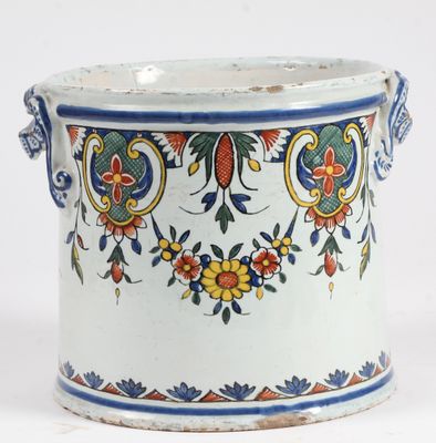 a white vase with a blue and red design on it