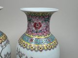 two vases that are sitting on a table