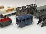 a lot of toy trains that are sitting on a table