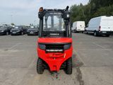 a red fork truck that is parked in a parking lot
