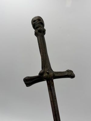 an image of a cross with a skull on it