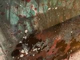 a close up of a piece of art with paint on it