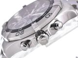 a close up of a watch on a white surface