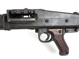 an old machine gun is on a white surface with a white background