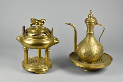pair of antique brass teapots and saucer on stand