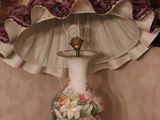 a lamp that is sitting on a table in front of a mirror