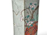 a vase with a design on it on a white background