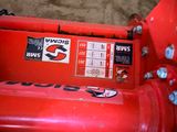 a red fire hydrant that has a sticker on it