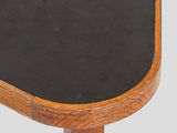 a close up of a small blackboard on a wooden table