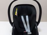 a baby car seat that is on a white table