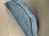grey wool eye mask on a brown background