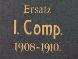 a close up of a book with gold writing on it