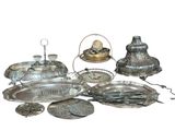 a lot of silver items that are sitting on the table