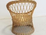 an image of a wicker chair sitting on top of a white floor