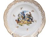 a plate with a picture of a man riding a horse on it