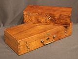 pair of antique wooden suitcases with brass handles