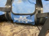 a blue duffel bag sitting on top of a table