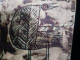 la photo d'un timbre avec un oiseau dessus