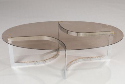 pair of clear glass coffee tables with curved bases