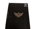 a nintendo switch lite with the legend of zeldan logo on it